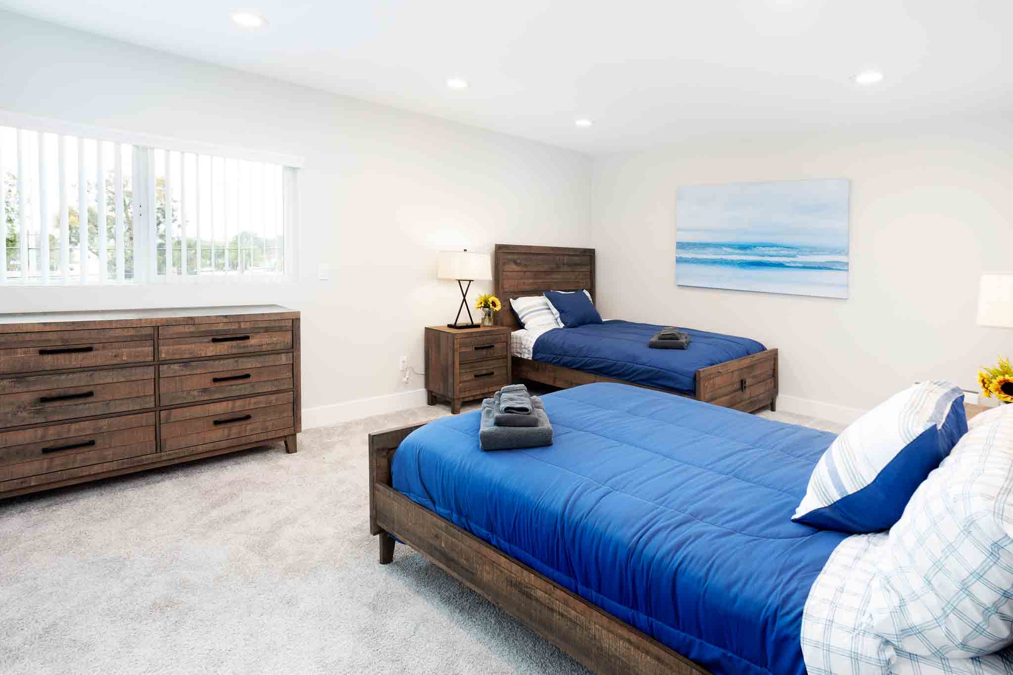 Photo of a room with two beds at a residential mental health treatment center in Los Angeles