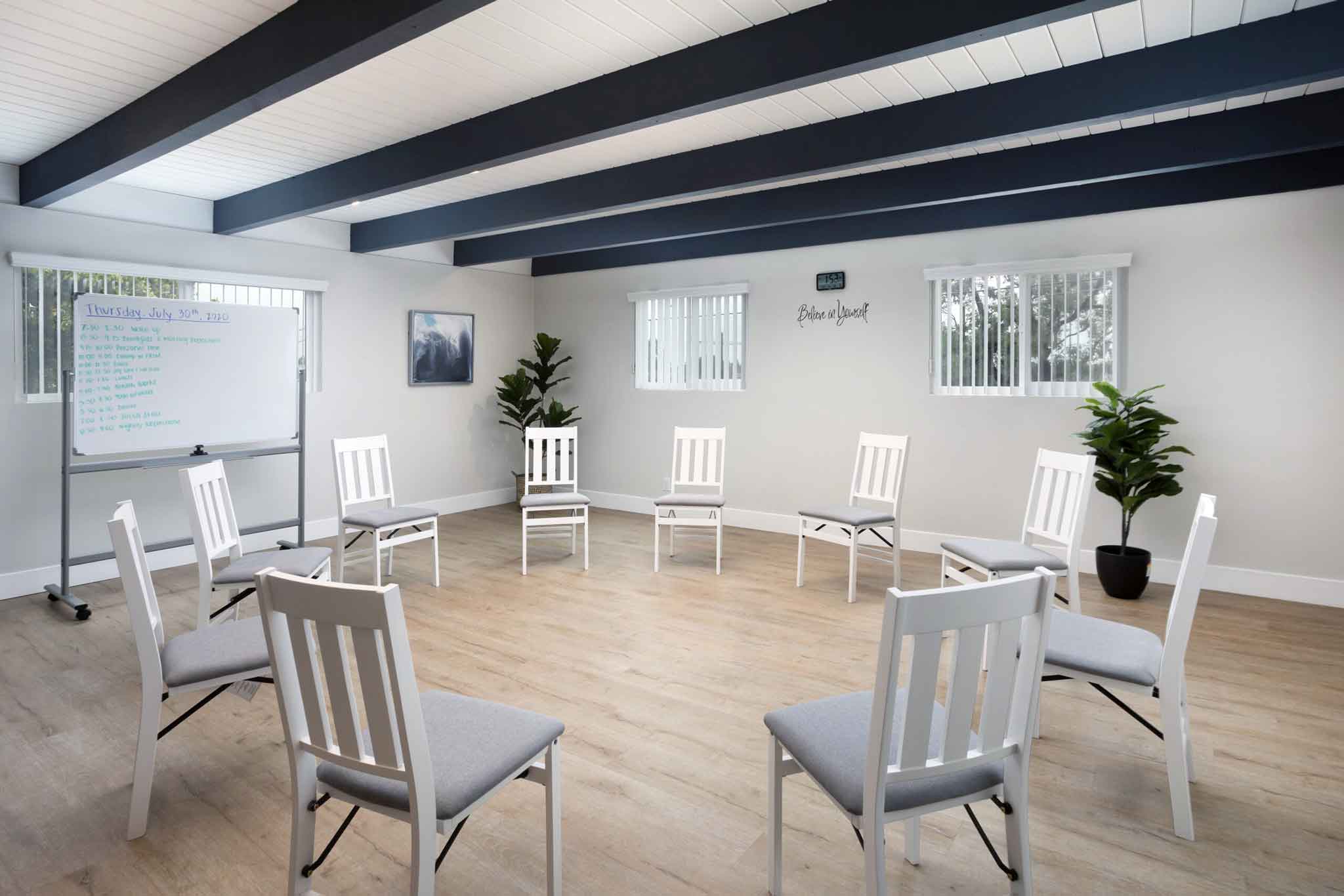 Photo of a group therapy room at a residential treatment center in Los Angeles with chairs in a circle.